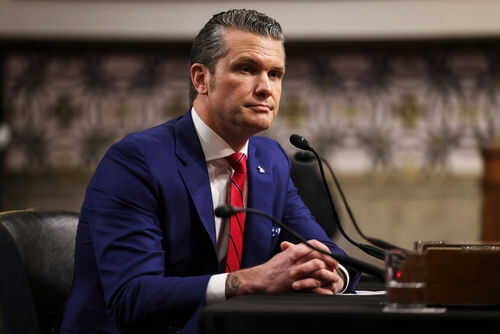 pete-hegseth2586168539jpg-1 Man in blue suit speaking at a microphone