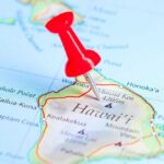 A red pushpin marking a location on a map of Hawaii