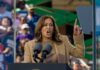 A woman passionately delivering a speech at an outdoor rally