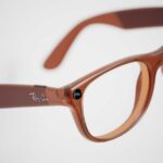 Brown plastic eyeglasses with clear lenses on a white background