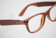 Brown plastic eyeglasses with clear lenses on a white background