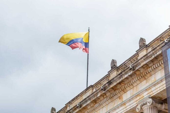 Colombian,Flag,Flying,At,The,Top,Of,The,Senate,Of Protesters holding a large justice banner and photos of missing people