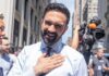 City-Backed Stores Crush Mom-and-Pops A smiling man in a light blue shirt gestures with his hand in an outdoor urban setting