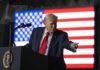 Missile Standoff Escalates — Trump Calls for Immediate Halt A man in a suit gestures while speaking at a podium with an American flag in the background