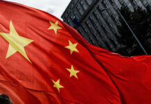 Swarm Tech Targets China’s Invasion Plan Close-up of the Chinese flag waving in the wind