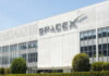 Billionaire Grab Won’t Save Washington SpaceX headquarters exterior with large logo on white building