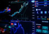 Wall Street Fraud: Tweet-and-Trade Exposed Colorful financial graphs and charts on a screen