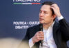 Musk Smeared? Mayor’s Explosive Claims Missing Proof Man in suit holding microphone at event indoors