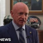 Sen. Mark Kelly says the U.S. government should be ‘more proactive’ about AI scams