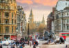View of London with Big Ben in the background and lion statues in the foreground