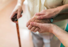 Fear Of Falls? Parkour Classes Quietly Surge Two hands clasped together, one elderly and one younger, symbolizing support