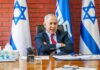 Lawfare Showdown: Will Bibi Survive? man in suit seated at desk with Israeli flags