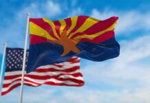 D.C. Meddling Sparks Arizona Firestorm Arizona state flag waving with U.S. flags in background