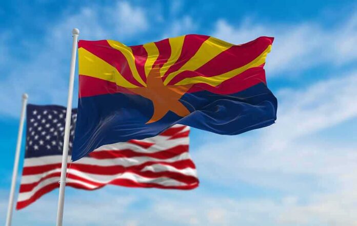 Arizona state flag waving with U.S. flags in background