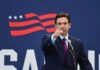 Fauci Under Fire—DeSantis Promises Consequences man in suit pointing while speaking at podium