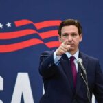 Fauci Under Fire—DeSantis Promises Consequences man in suit pointing while speaking at podium