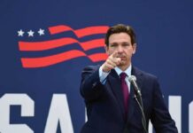 Fauci Under Fire—DeSantis Promises Consequences man in suit pointing while speaking at podium