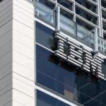 Close-up of the IBM logo on a modern corporate building