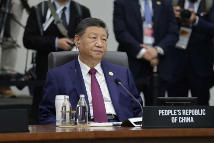 Gyeongju,,Korea,-,October,1,2025:,President,Of,The,People's A leader seated at a conference table during an international summit