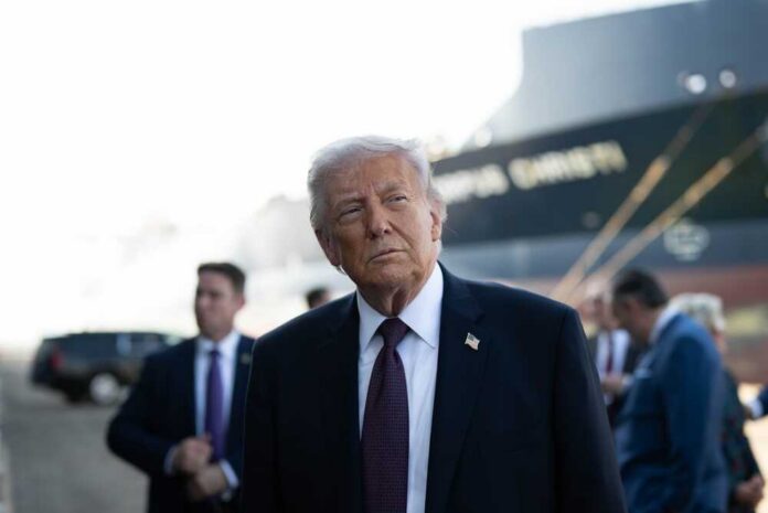 President,Donald,J.,Trump,Delivers,Remarks,On,Energy,At,The A political figure standing outdoors with a serious expression