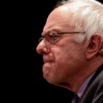 $10.5B Shock: Sanders Taunts Zuckerberg elderly man in profile wearing glasses