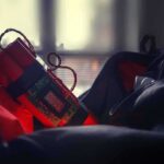 Timer device with red cylinders inside an open bag