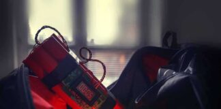 Timer device with red cylinders inside an open bag