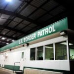Border patrol checkpoint building at night