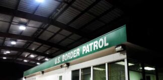 Border patrol checkpoint building at night