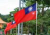Taiwan flag waving on a pole in a green park