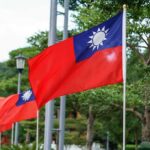 Taiwan flag waving on a pole in a green park