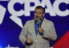 100% Vote? Trump’s Wild Cruz Pitch Man speaking at a conference with microphone