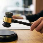 Soft-On-Crime Math Lets Rapist Out Early Judge's hand holding a gavel over a sound block