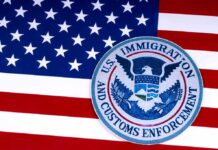 U.S. immigration and customs enforcement seal on American flag