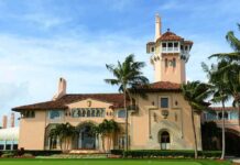 Weaponized Justice? Mar-a-Lago Raid Under Fire Mediterranean Revival mansion with tower and palm trees