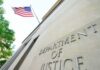 DOJ: Comey’s Post Crossed the Line Department of Justice building with American flag