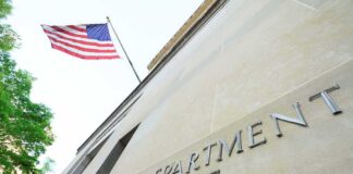 Department of Justice building with American flag