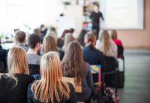 Hate Invades Classrooms — ADL Sounds Alarm Students seated in a classroom listening to a presentation