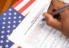 Landlord Framed—Election And ICE Weaponized Hand filling out a voter registration form beside an American flag