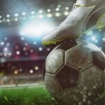 Trafficking Rings Crushed Amid Matches soccer cleat on a ball under stadium lights