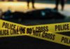 yellow police tape at a nighttime crime scene
