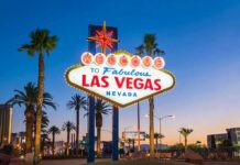 Tip Taxes Axed? Vegas Crowd Loses It Welcome to Las Vegas sign at dusk