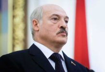 NATO Jitters: China-Belarus Drill Teases Urban Shock man in suit with mustache at formal event