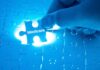 Subsidy Tsunami – Trillion-Dollar Health Blowout Looms Hand placing a puzzle piece labeled Medicare