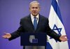 UN Uproar: War Crimes Showdown – Proof or Propaganda? man in suit speaking at a podium with Israeli flag