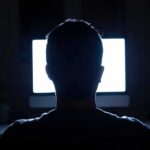 Pentagon Videos Finally Surface – Archives Hold Hours person silhouetted in front of a bright computer screen