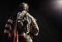 Inside Iran: Daring U.S. Extraction Soldier in tactical gear with American flag over shoulder