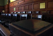 Frat House Nightmare – DA Reopens Explosive Cornell Case Empty wooden jury box with numbered chairs