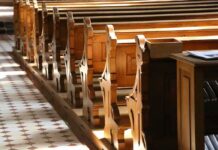 Church Body ID’d – Boise Cyanide Death Sparks Tylenol Whispers wooden church pews in sunlight