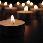 Tealight candle burning with soft glow